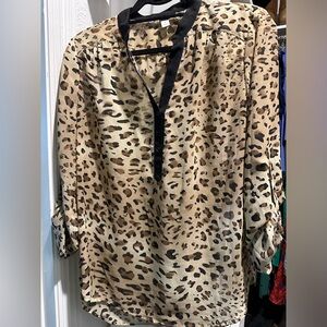 Cheetah print blouse, 3/4 button down with roll up button sleeves. Size medium